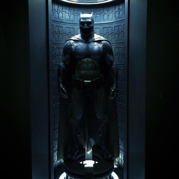 Image result for bruce wayne looking at bat suit