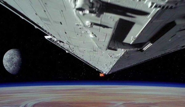 The Imperial Star Destroyer attacks a Rebel ship at the beginning of Star Wars