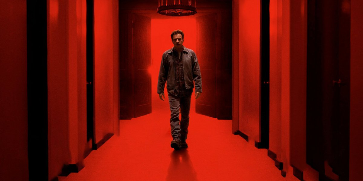 Doctor Sleep Danny Torrance walking in a red corridor