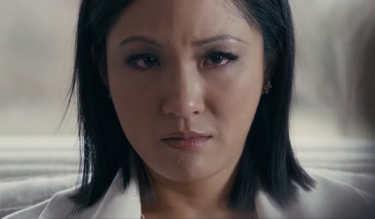 Hustlers Constance Wu looks towards the camera with disdain