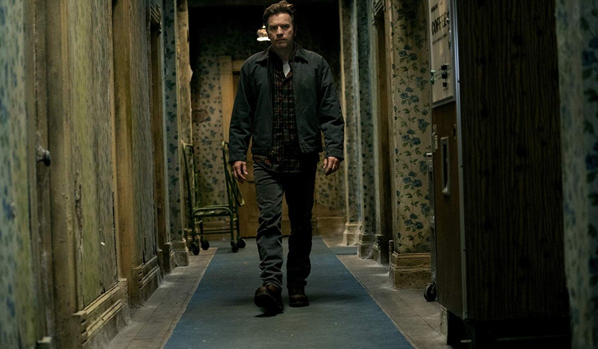 Doctor Sleep Danny Torrance walking down an Overlook hallway