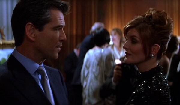 The Thomas Crown Affair Pierce Brosnan has a friendly chat with Rene Russo at an art show