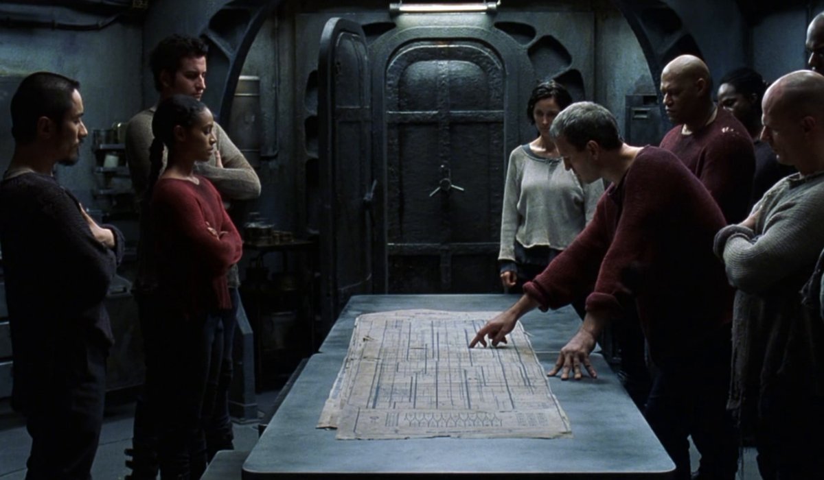 The Matrix Revolutions strategy meeting with Niobe, Trinity, Morpheus, and other officers