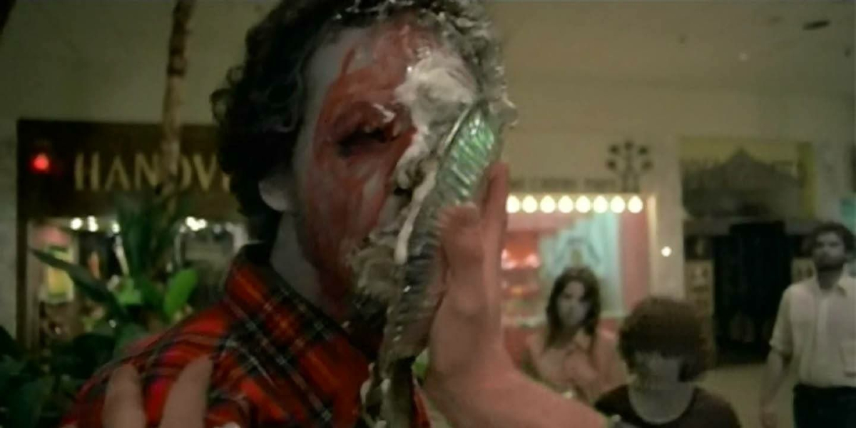 A zombie getting hit in the face with a pie in Dawn of the Dead