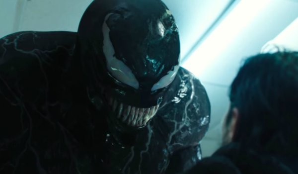 Venom about to eat a man in a convenience store