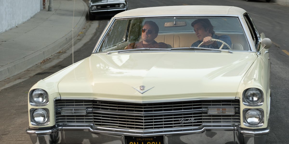 Leonardo DiCaprio and Brad Pitt driving in a car in Once Upon A Time In Hollywood