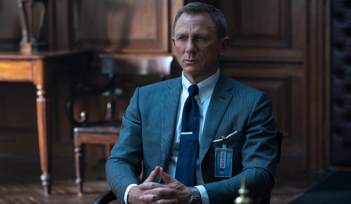 Daniel Craig sits patiently in an office in No Time To Die.