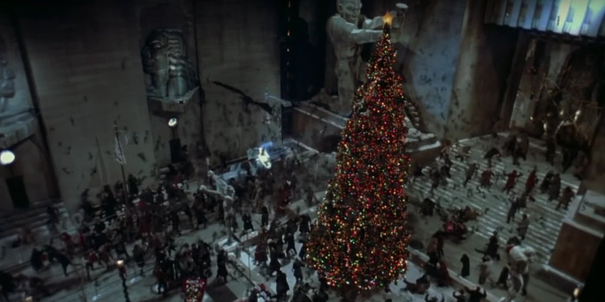 Batman (Michael Keaton) soars around the Gotham City Christmas tree in Batman Returns