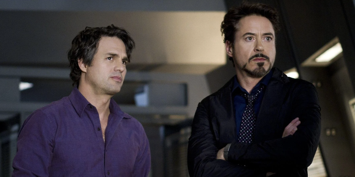 Bruce Banner stands next to a cross-armed Robert Downey Jr. in 'The Avengers'