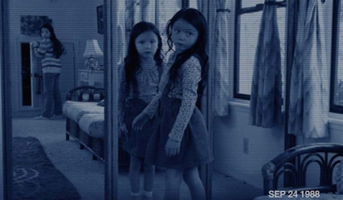 Paranormal Activity 3 a young girl's reflection stares at her