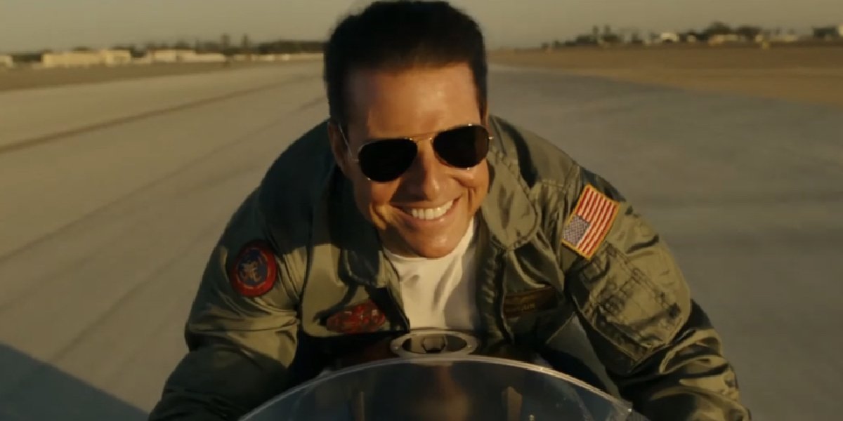Top Gun: Maverick Tom Cruise riding his bike with a smile
